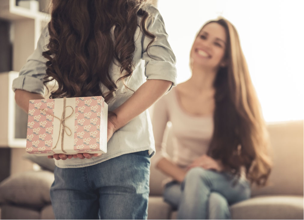 Woman giving other woman gift