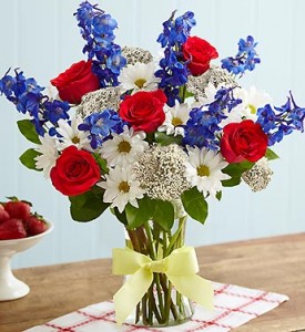red, white and blue flowers with yellow ribbon