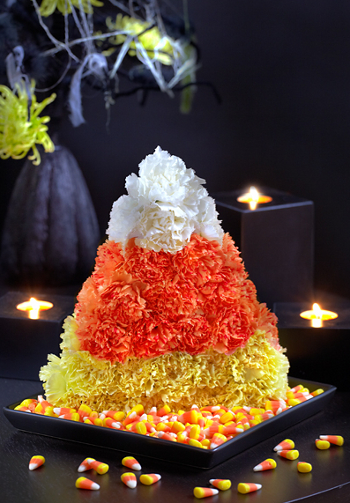 Halloween centerpieces with candy corn floral arrangement