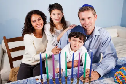 family activities for hanukkah with Jewish Family Celebrating Hanukkah