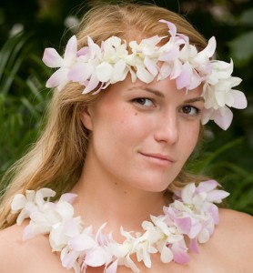a photo of how to host a luau party with a girl wearing leis
