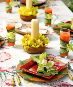 a photo of how to host a luau party with a Hawaiian tablescape