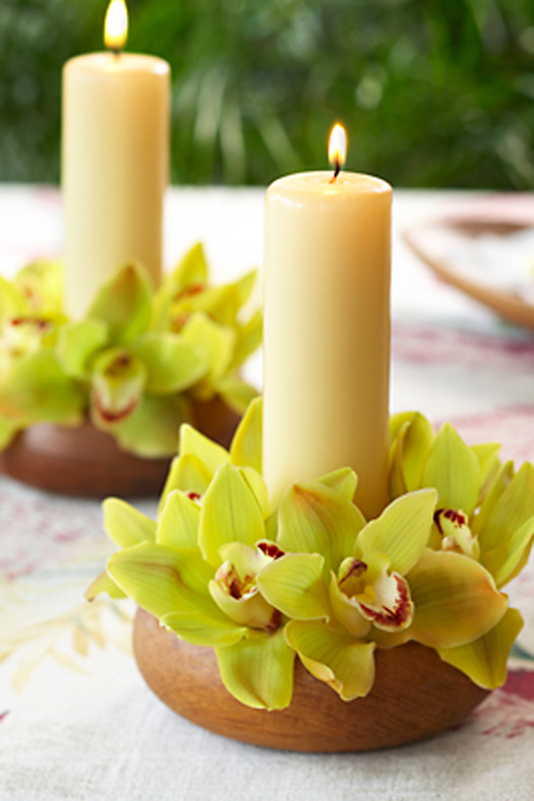 a photo of how to host a luau party with Hawaiian table centerpiece with cymbidium orchids