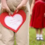 Boy Hiding Valentine's Day Card From Girl