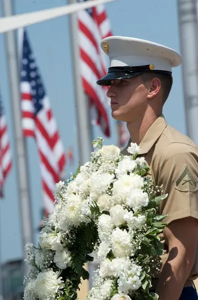 US Marine Soldier Holds 1-800-Flowers Wreath During USS Intrepid's Annual Memorial Day Ceremony