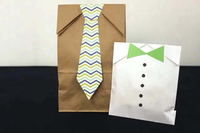 A photo of diy gift bags with Gift Bags Decorated With Paper Ties and Buttons