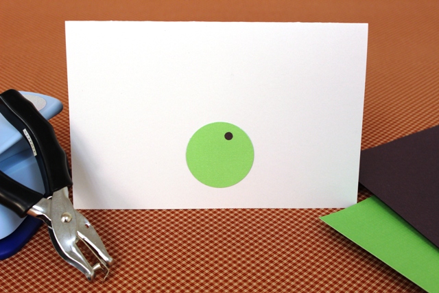 Green and Black Hole Punches Glued on Cardstock to Make Putting Green for Golf Father's Day Card