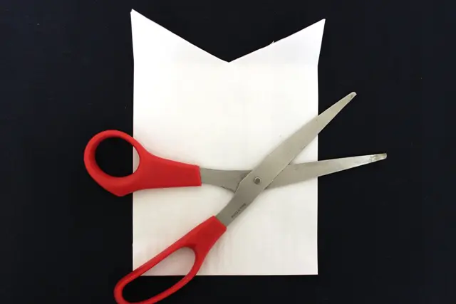 A photo of diy gift bags with Trimmed Paper Bag to Create a Collared Shirt