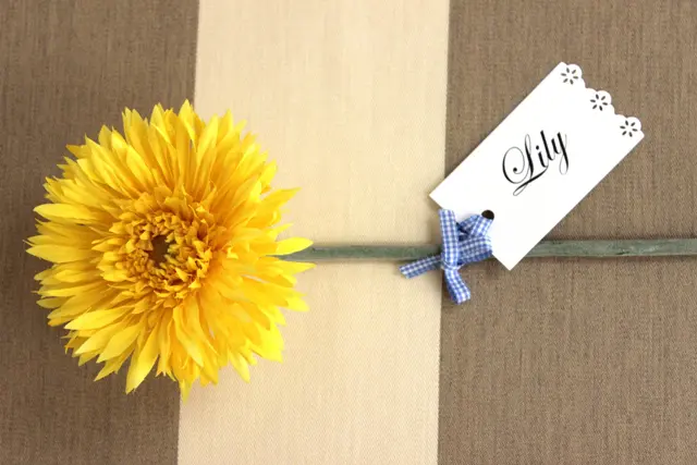 diy wedding decor with Place Card Tied to Silk Flower