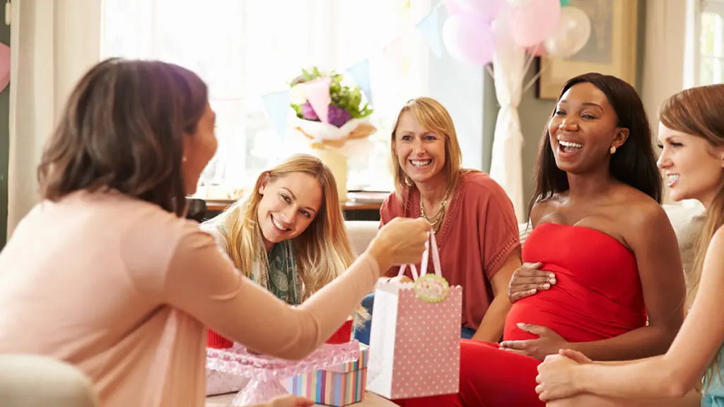 Group Of Female Friends Meeting For Baby Shower At Home