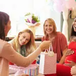 Group Of Female Friends Meeting For Baby Shower At Home