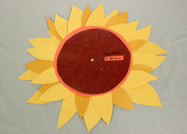 a photo of a sunflower wheel of appreciation: mom is my hero message