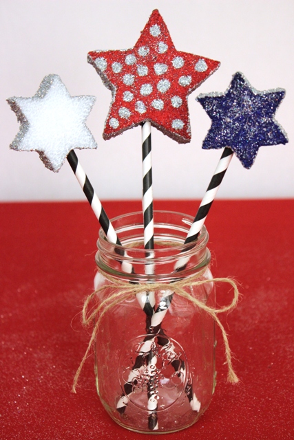 Styrofoam Stars Decorated With Glitter and Attached to Striped Straw Handles