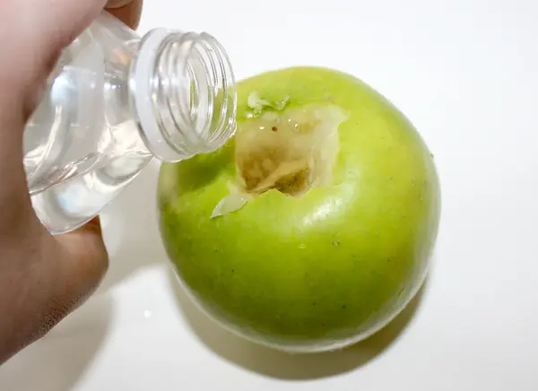 apple vase with pouring water in apple