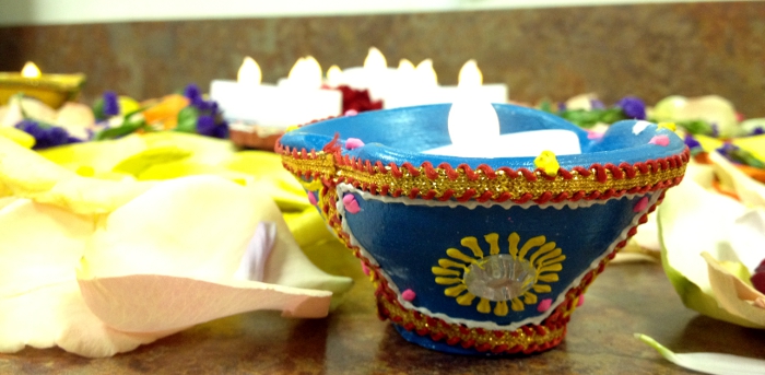 Diwali Diyas Surrounded by Flower Petals