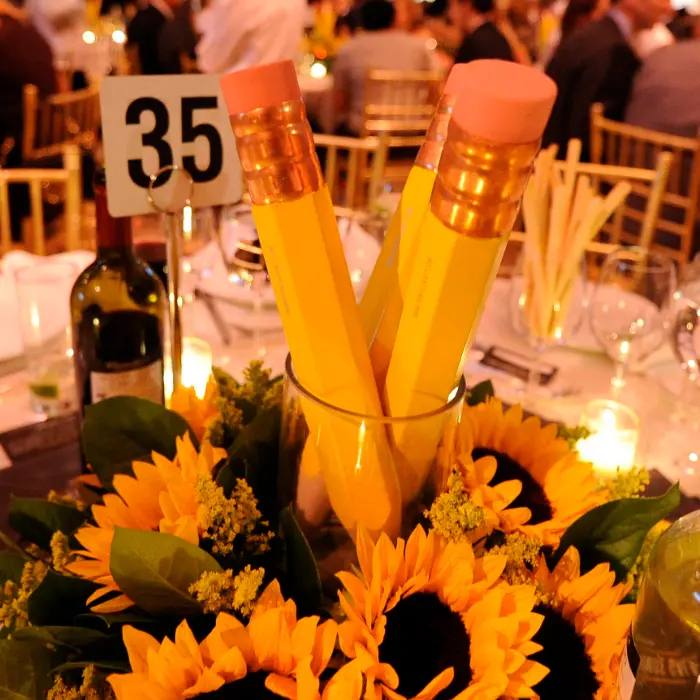 education floral centerpiece with pencils sunflowers