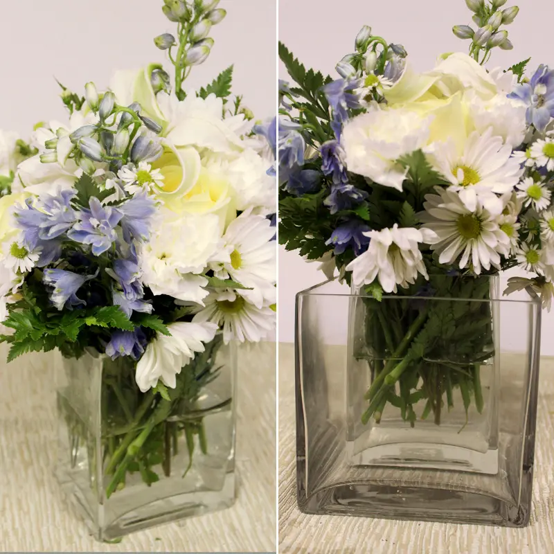 Hanukkah centerpiece with a vase of flowers.