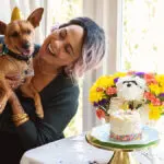 dog birthday party owner holding dog