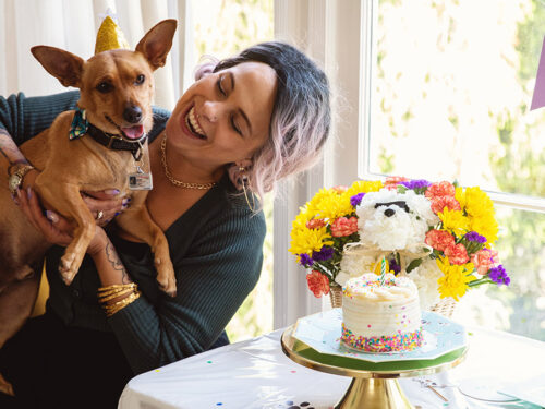 dog birthday party owner holding dog