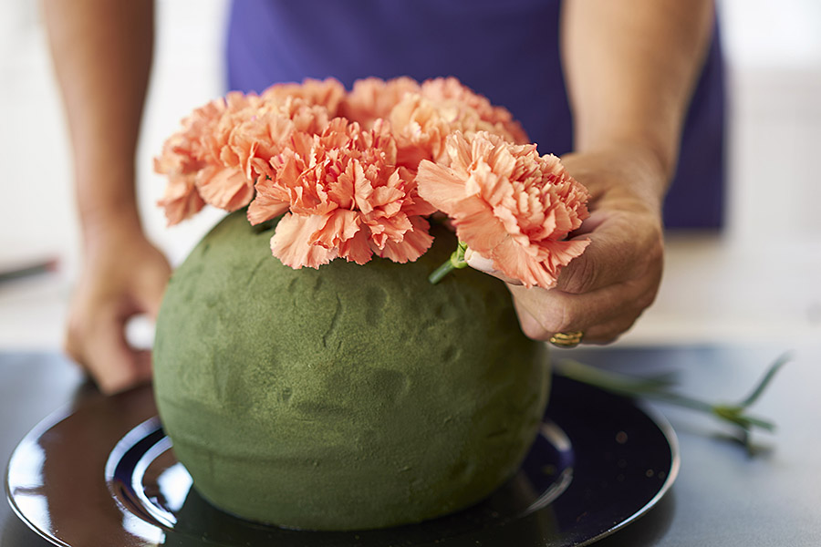 pumpkin decorations with inserting carnations into foam