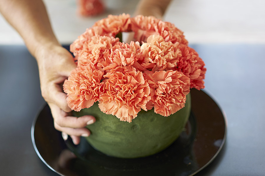 pumpkin decorations with Continue adding flowers in foam