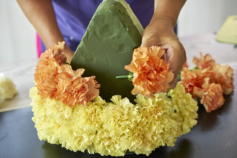 candy corn decorations two rows of orange carnations