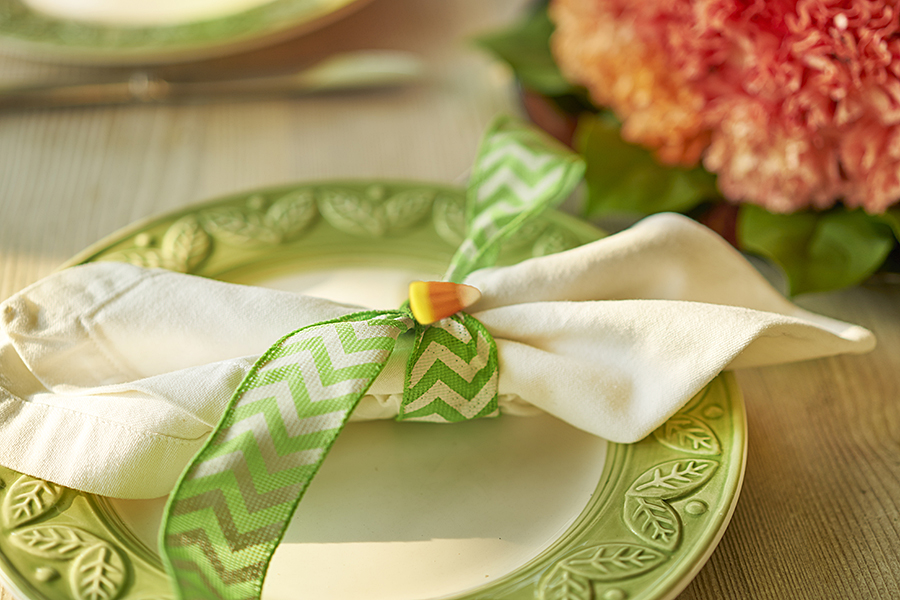 pumpkin decorations with Halloween Table Setting with Candy Corn Napkin Holders