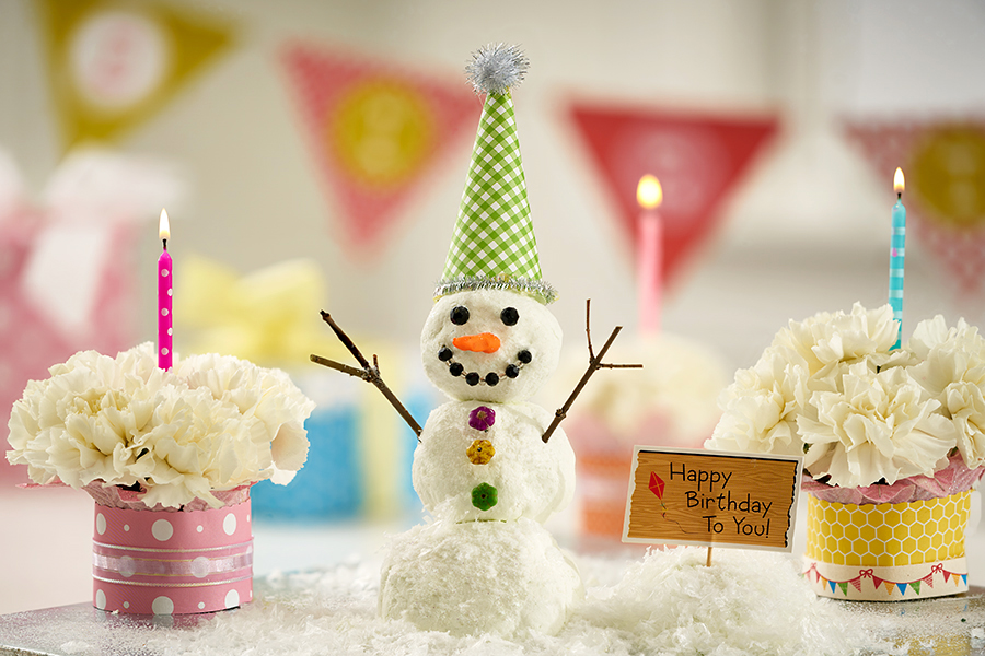 Winter Birthday Snowman Setup with Flower Cupcakes