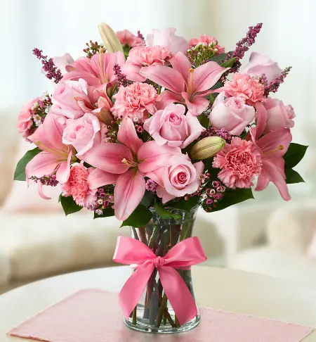 Pink flower bouquet with pink lilies, pink roses, pink carnations and more.