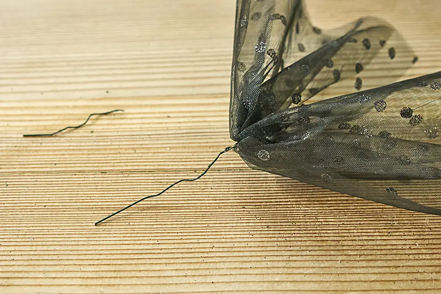 Hold pieces of tulle together with wire