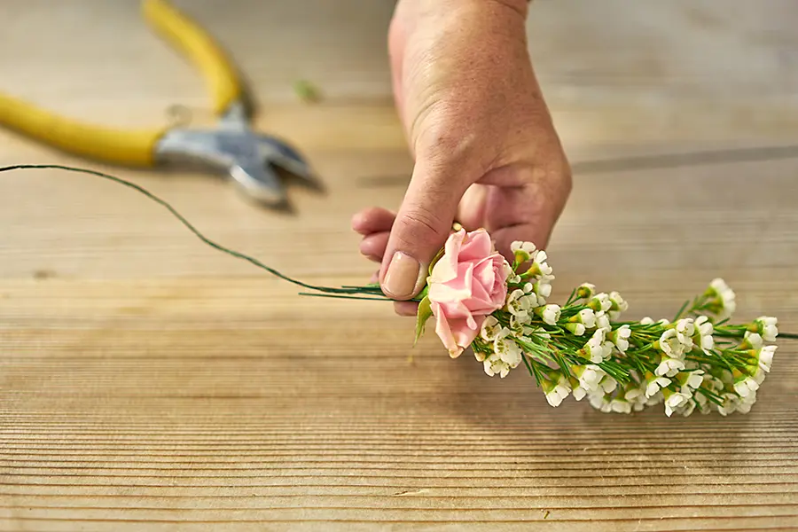 Attach rose to flower crown