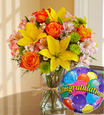 Fields of Europe for Spring with Congratulations Balloon Yellow Lilies & Orange Roses Arrangement with Congratulations Balloon