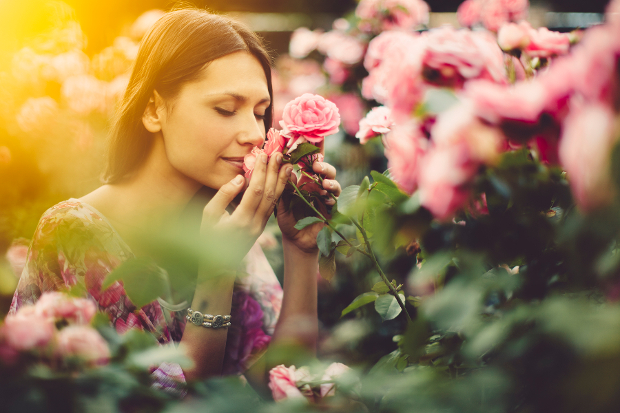 Girl Smelling flowers