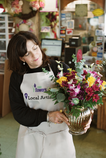 Ann Marie Pierce Holding Flower Arrangement