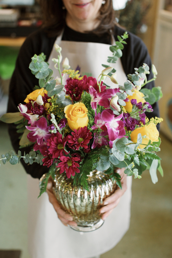 Florist Holding Flowers Close-Up