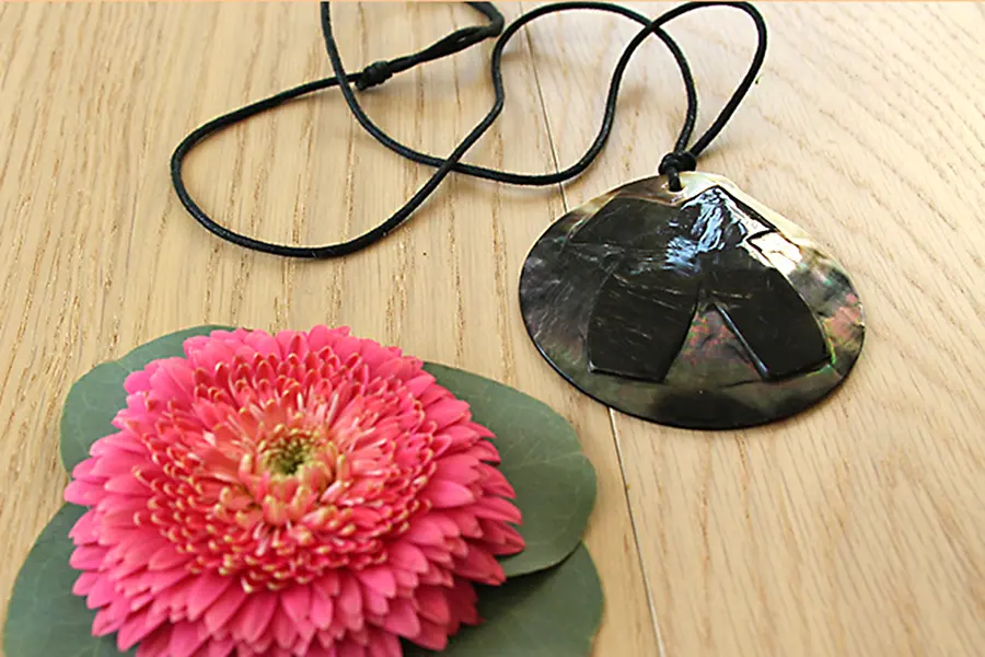 add flower to necklace