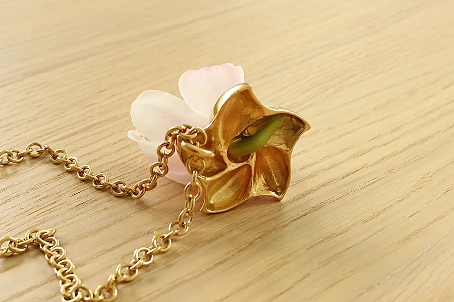 a photo of a finished orchid necklace