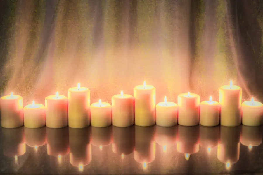 winter holidays with Lit Gold Pillar Candles