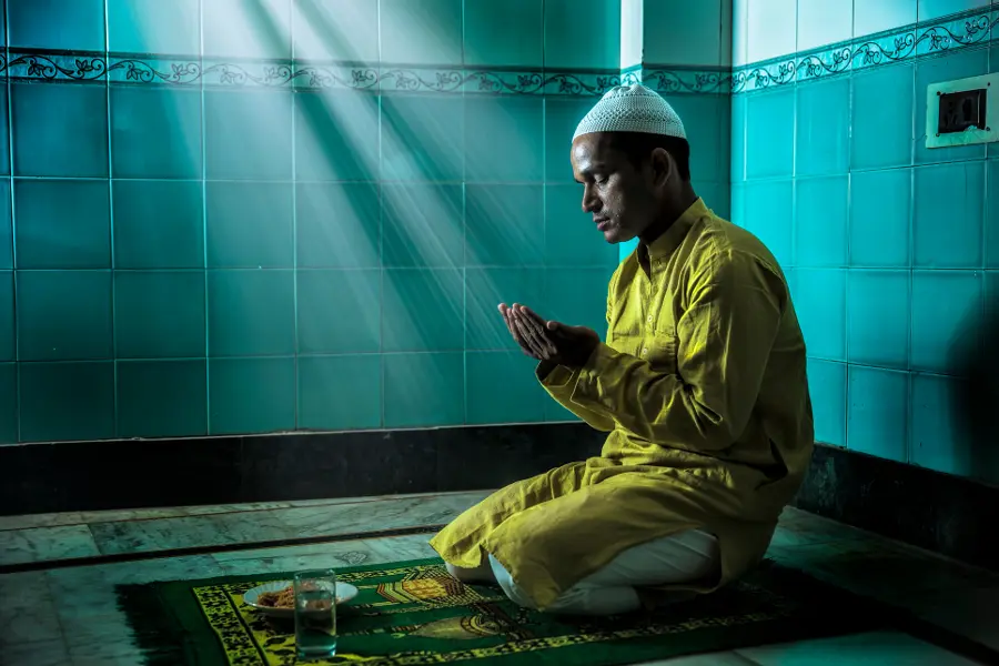 winter holidays with Muslim Man Praying During Mawlid al-Nabi