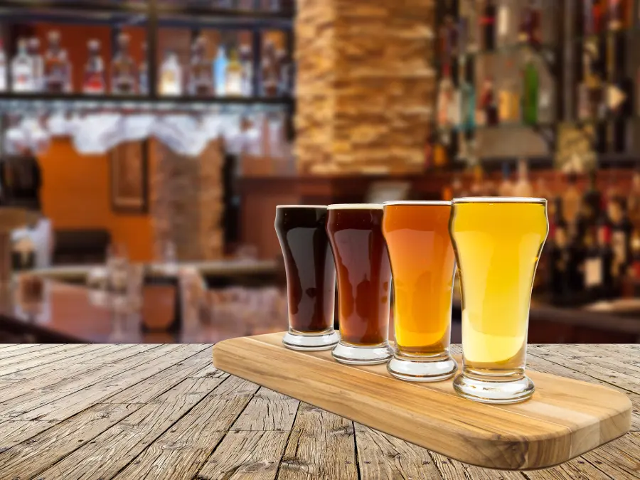 Rainy day date ideas with a flight of beer on a table.