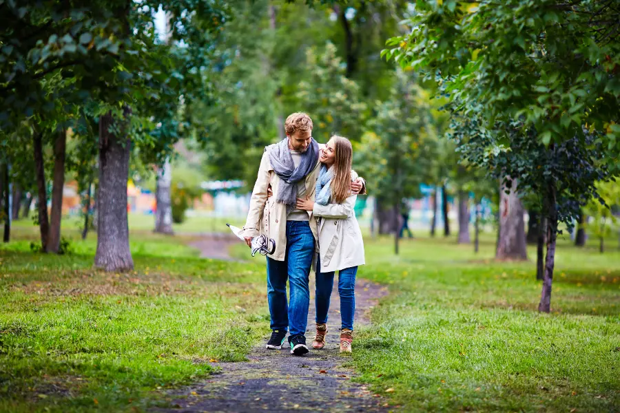 Couple walking through the park