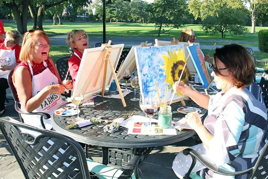 ladies-having-fun-painting-outside