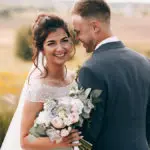 wedding bouquet with bride holding wedding bouquet with husband