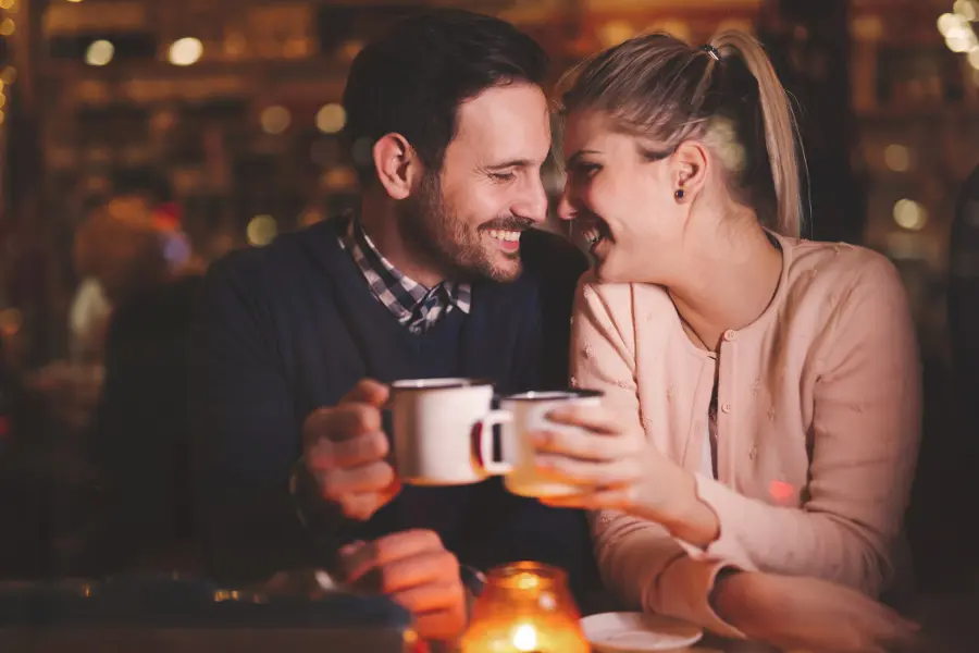 anniversary date ideas with Couple on a date with coffee mugs