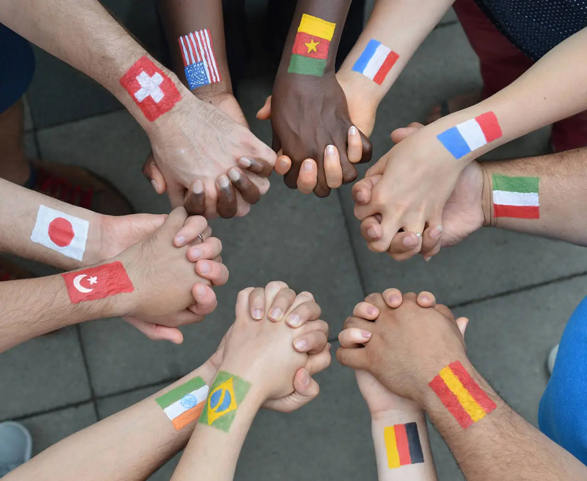 photo of International Day of Peace with people from different countries holding hands