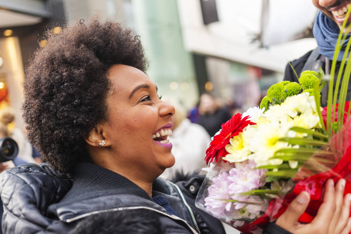 photo of International Day of Peace with a woman receiving flowers 