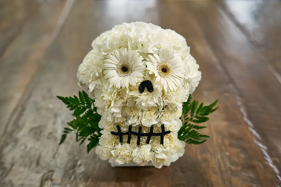 flower sugar skull on wooden table