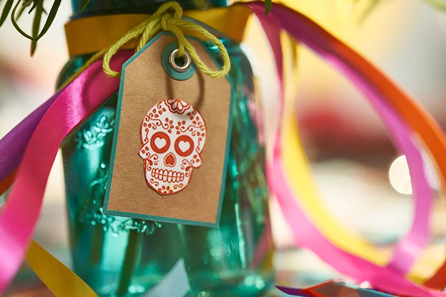 day of the dead marigolds in centerpiece sugar skull tag