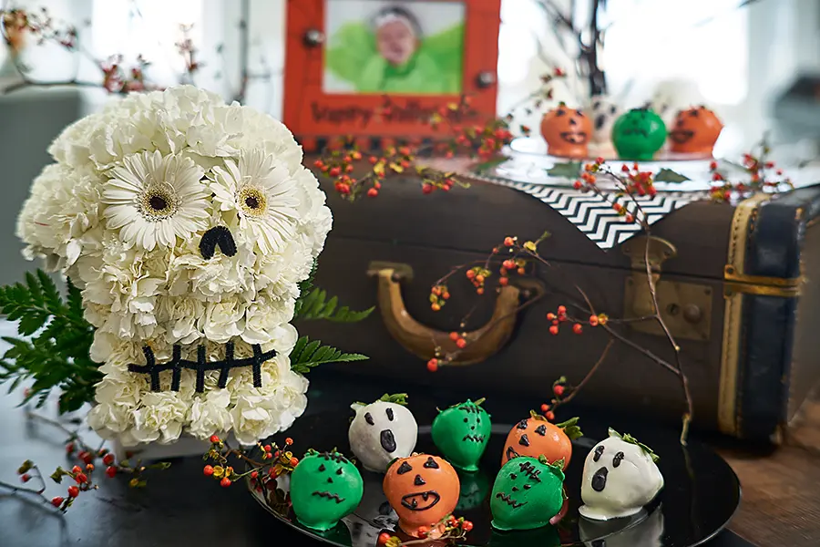 flower sugar skull arranged with halloween chocolate covered strawberries 