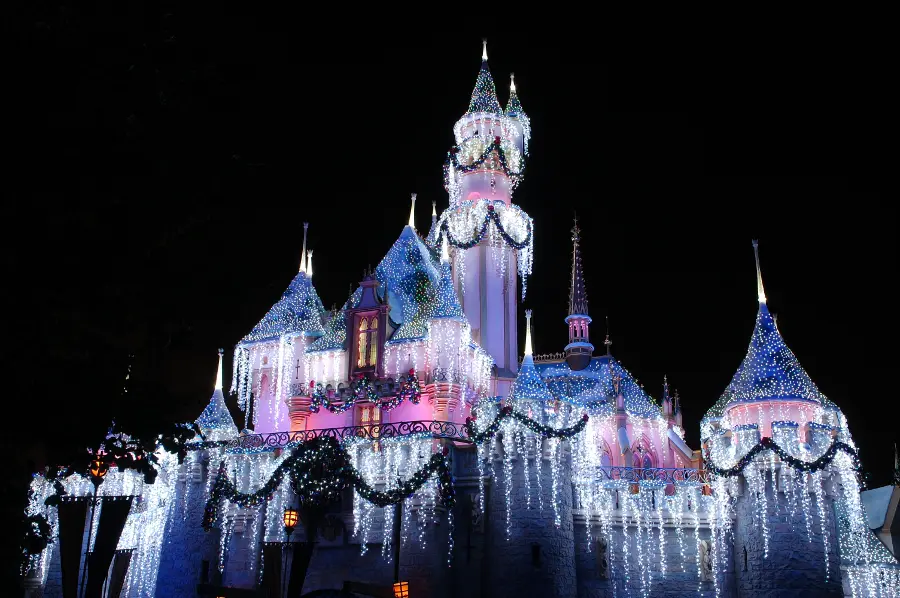 holiday city guide disneyland castle with christmas lights 